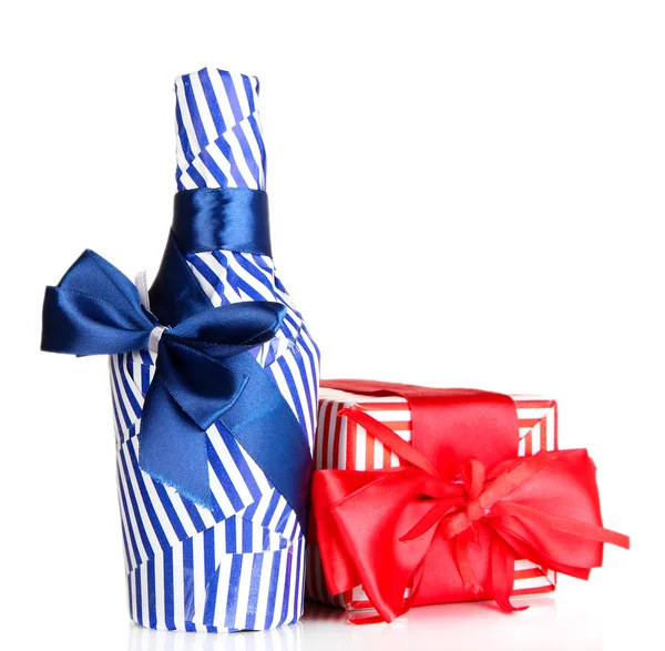 Bottle packed in gift paper with gift isolated on white — Stock Photo, Image