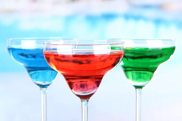 Different cocktails on bright background — Stock Photo, Image