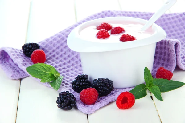 Delicious yogurt with berries on table close-up Royalty Free Stock Images