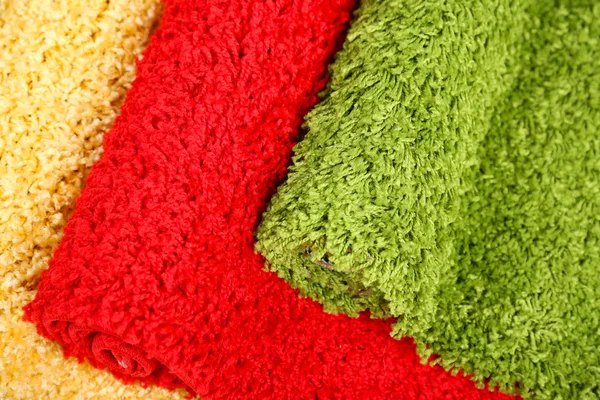 Many carpets of different colors close-up — Stock Photo, Image