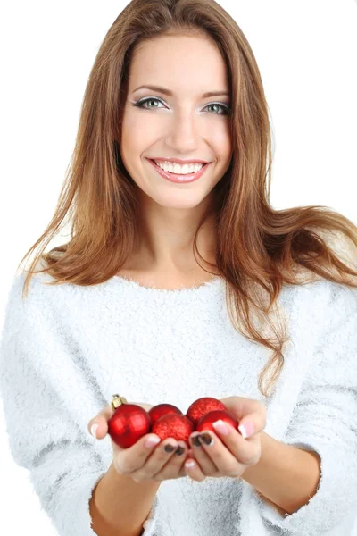 Beautiful smiling girl with Christmas toys isolated on white — Stock Photo, Image