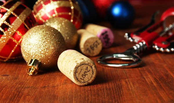 Wine corks with new Year toys on wooden table close-up — Stock Photo, Image