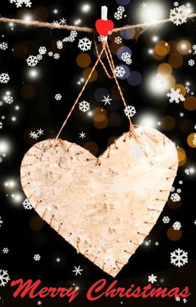 Decorative heart on rope on shiny background — Stock Photo, Image