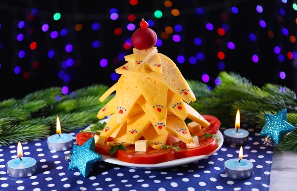 Christmas tree from cheese on table on dark background — Stock Photo, Image