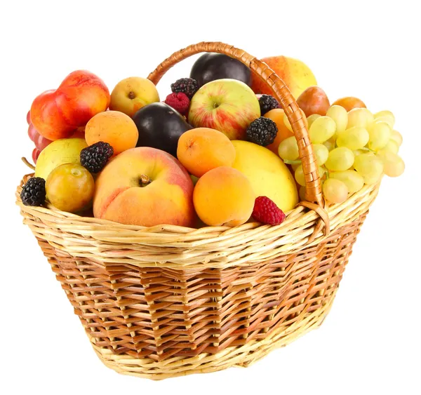 Still life of fruit in basket isolated on white — Stock Photo, Image