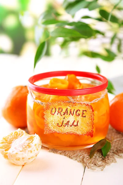 Orange jam with zest and tangerines, on white wooden table — Stock Photo, Image