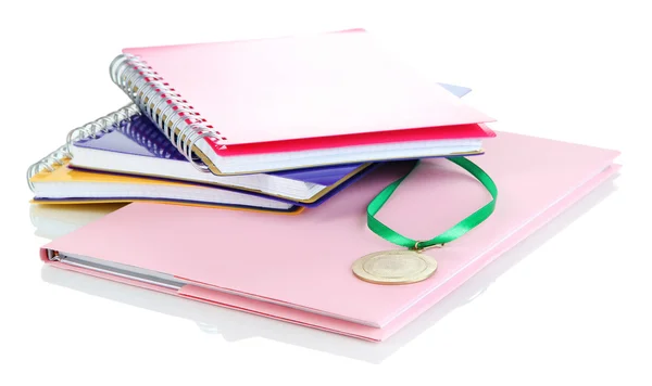 Medal for achievement in education and notebooks isolated on white — Stock Photo, Image