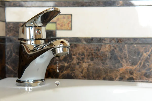 Ceramic sink with chrome fixture, close up — Stock Photo, Image