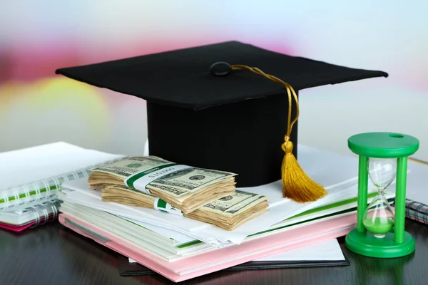 Money for graduation or training on wooden table close-up — Stock Photo, Image