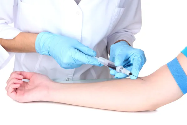 Nurse takes blood from the veins isolated on white — Stock Photo, Image