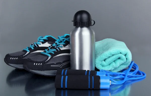 Different tools for sport on grey background — Stock Photo, Image