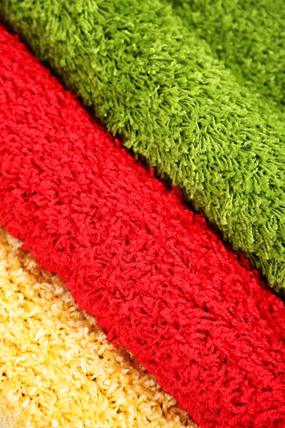 Många mattor i olika färger närbild — Stockfoto