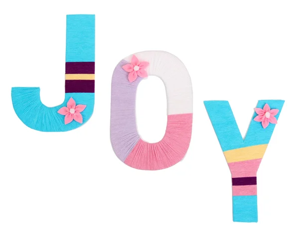 Word Joy created with brightly colored knitting yard isolated on white — Stock Photo, Image