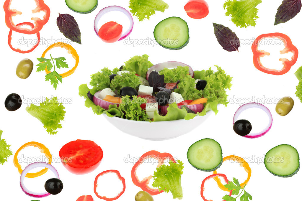 Fresh mixed vegetables around bowl of salad close up