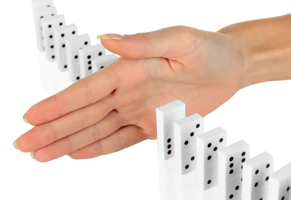 Mão parando dominós caindo isolado no branco — Fotografia de Stock