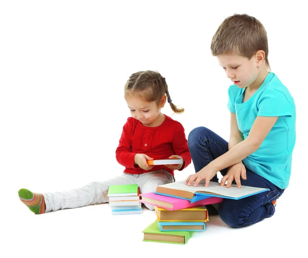 Niños pequeños con libros aislados en blanco —  Fotos de Stock