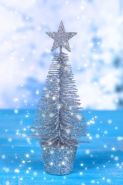 Decorative Christmas tree on winter background — Stock Photo, Image