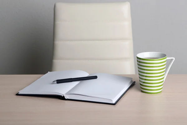 Empty workplace in office on gray background — Stock Photo, Image