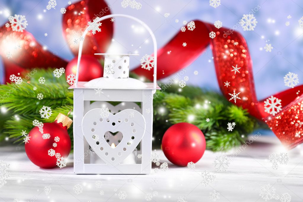 Composition with Christmas lantern, fir tree and decorations on light background