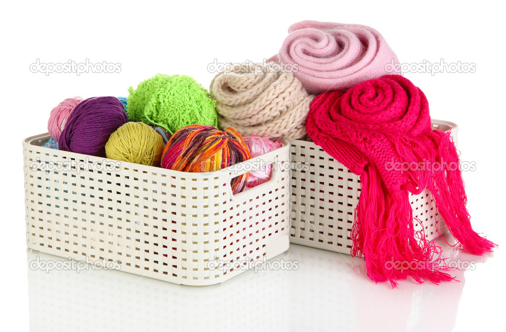 Plastic baskets with things isolated on white
