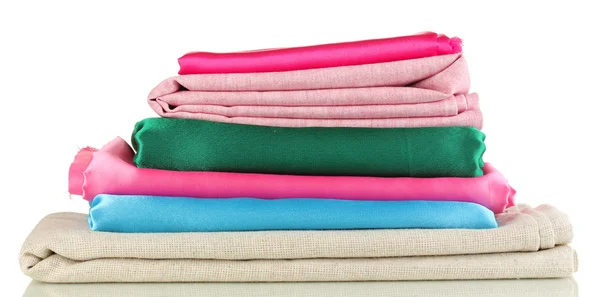 Pile of different fabrics isolated on white — Stock Photo, Image