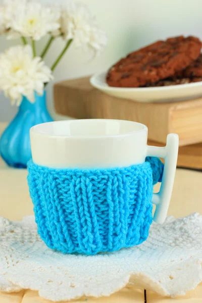 Cup with knitted thing on it close up — Stock Photo, Image