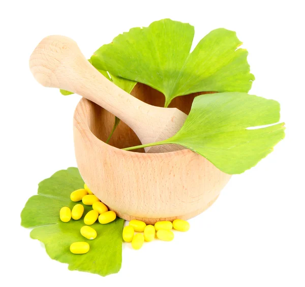 Ginkgo biloba leaves in mortar and pills isolated on white — Stock Photo, Image