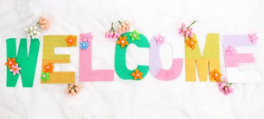 parlak renkli örgü kumaş arka bahçede ile oluşturulan word Hoşgeldiniz