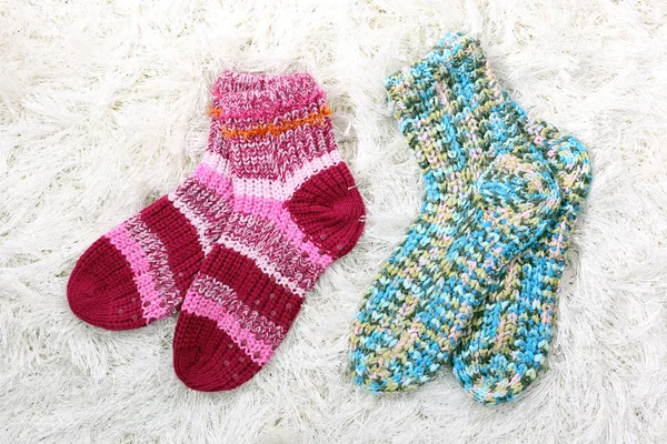 Woolen socks, on color background — Stock Photo, Image