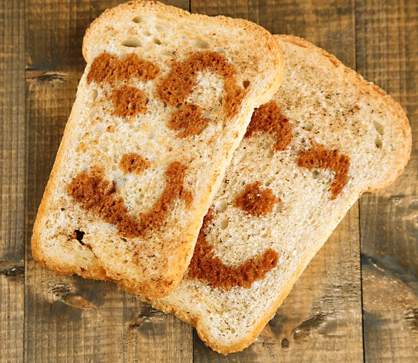 Funny toasts, on wooden background — Stock Photo, Image