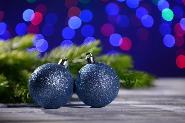 Christmas decorations on wooden table, on bright background — Stock Photo, Image