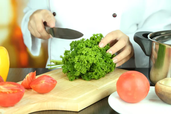 Cook hands cutting parsley — Stock Photo, Image