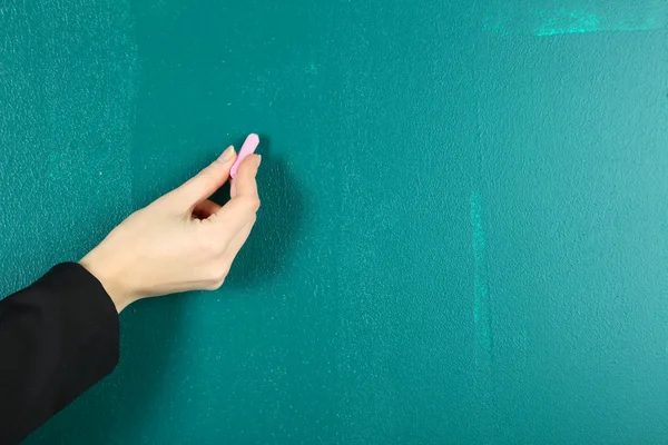 Hand writing on blackboard in class room — Stock Photo, Image