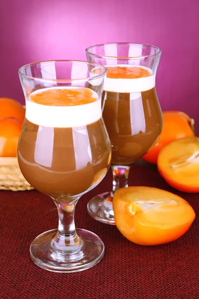 Dessert of chocolate and persimmon on table on purple background — Stock Photo, Image