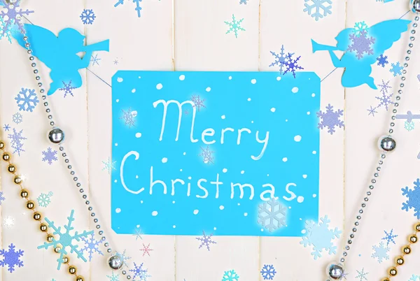 Signboard with words Merry Christmas on wooden table background close-up — Stock Photo, Image