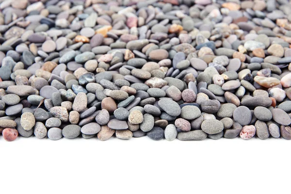 Small sea stones, isolated on white — Stock Photo, Image