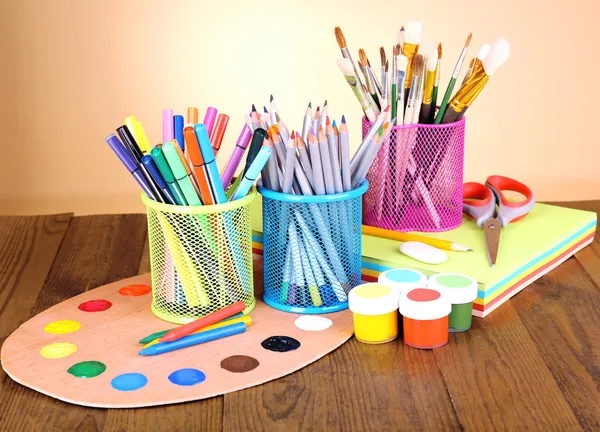 Composition of various creative tools on table on beige background — Stock Photo, Image