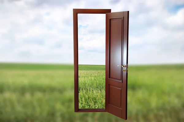 Open door to new life on the field — Stock Photo, Image