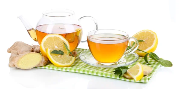 Kettle and cup of tea with ginger on napkin isolated on white — Stock Photo, Image