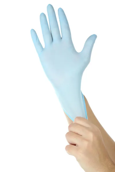 Médico poniéndose guantes protectores, aislado en blanco —  Fotos de Stock