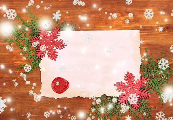 Frame with vintage paper and Christmas decorations on wooden background — Stock Photo, Image