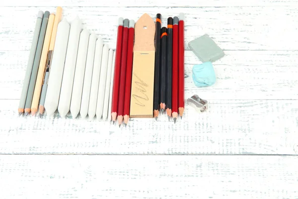 Professional art materials, on wooden table — Stock Photo, Image
