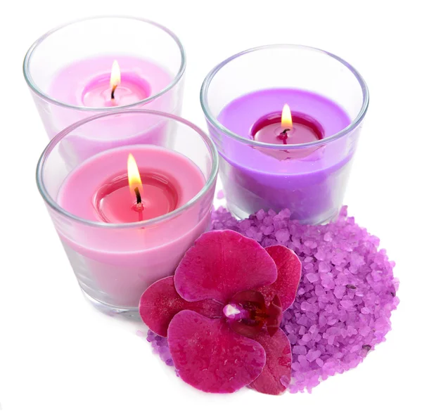 Beautiful colorful candles, orchid flower, sea salt isolated on white — Stock Photo, Image