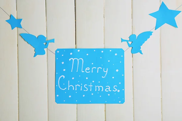 Signboard with words Merry Christmas on wooden table background close-up — Stock Photo, Image