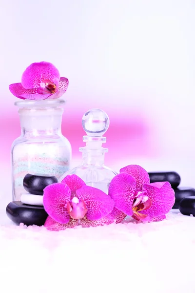 Beautiful spa setting with orchid on white wooden table on bright background — Stock Photo, Image