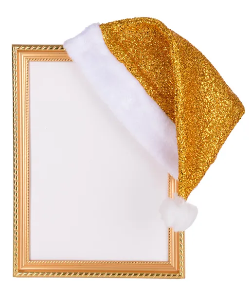 Christmas hat hung on old frame isolated on white — Stock Photo, Image