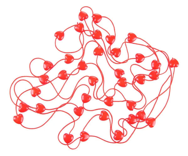 Серцеподібні намистини на нитці ізольовані на білому — стокове фото