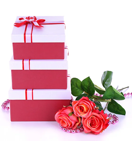 Beautiful gift boxes with flowers isolated on white — Stock Photo, Image