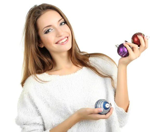 Menina sorridente bonita com brinquedos de Natal isolado no branco — Fotografia de Stock