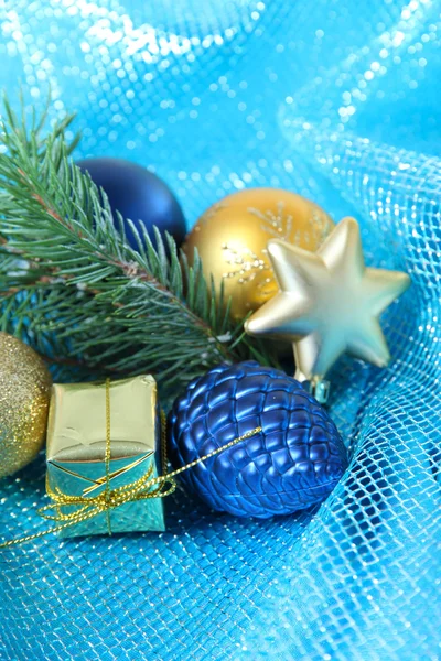 Beautiful Christmas decor on blue cloth — Stock Photo, Image